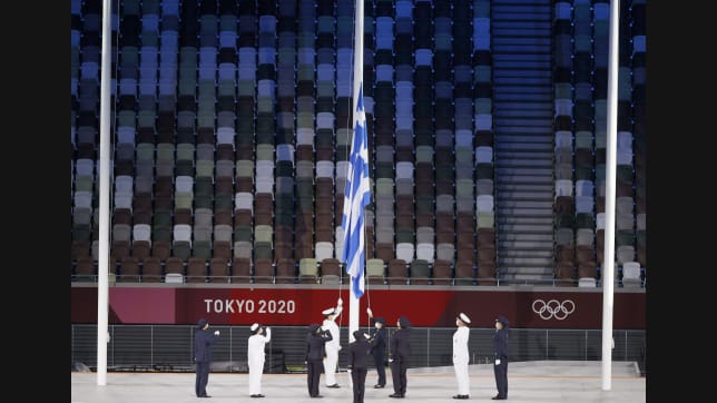 TOKYO, JAPAN - AUGUST 08: The Greece flag is raised during the Closing Ceremony of the Tokyo 2020 Olympic Games at Olympic Stadium on August 08, 2021 in Tokyo, Japan. (Photo by Steph Chambers/Getty Images)