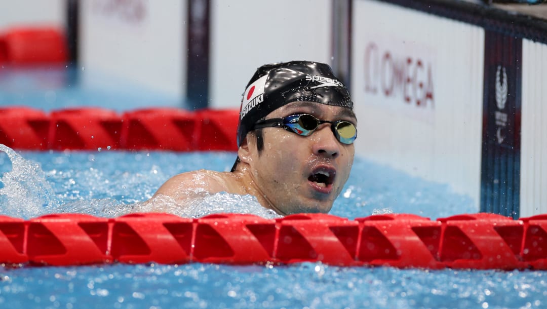 TOKYO, JAPAN - AUGUST 26: SUZUKI Takuyaki of Team Japan finishes to win the gold medal after competing in the Men's 100m Freestyle S4 final on day 2 of the Tokyo 2020 Paralympic Games at the Tokyo Aquatics Centre on August 26, 2021 in Tokyo, Japan. (Photo by Adam Pretty/Getty Images)
