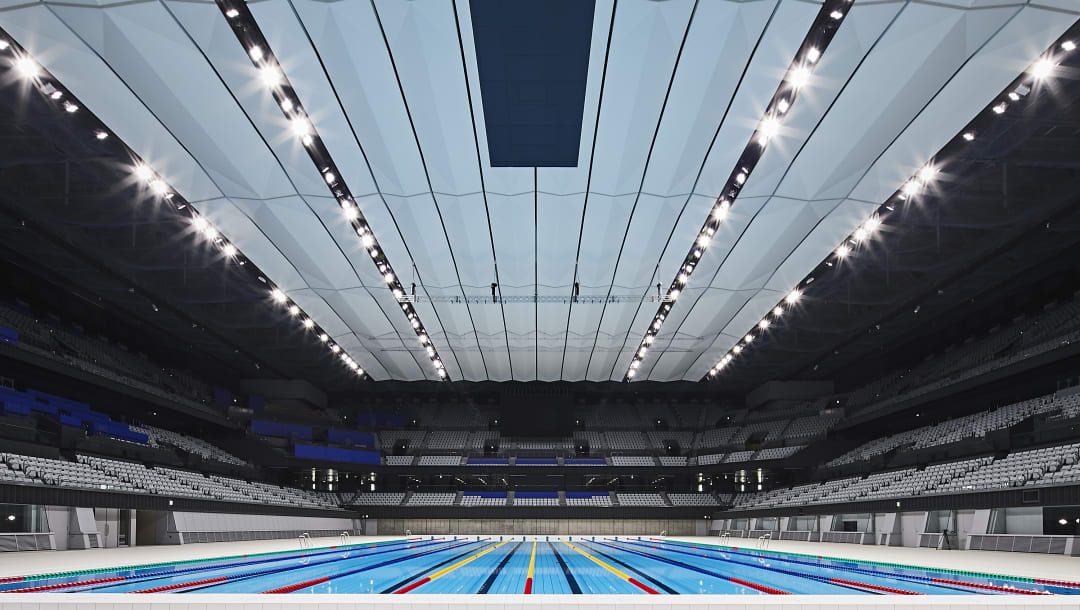 An internal view of the Tokyo Aquatics Centre.