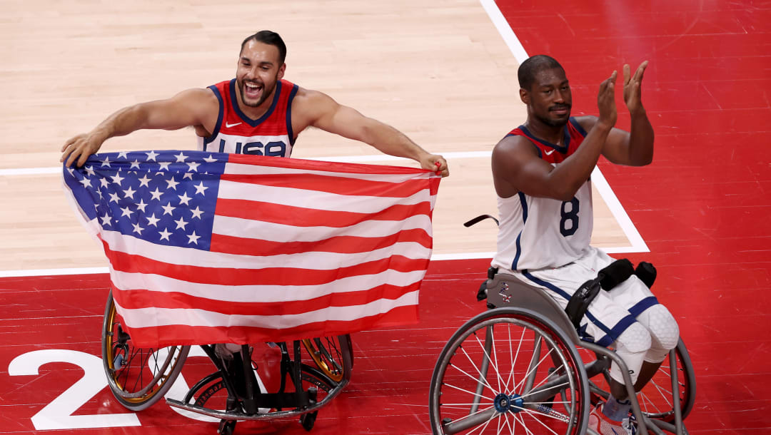 TOKYO, JAPAN - SEPTEMBER 05: Jorge Sanchez #1 and Brian Bell #8 of Team United States celebrate after defeating Team Japan during the men's Wheelchair Basketball gold medal game on day 12 of the Tokyo 2020 Paralympic Games at Ariake Arena on September 05, 2021 in Tokyo, Japan. (Photo by Lintao Zhang/Getty Images)