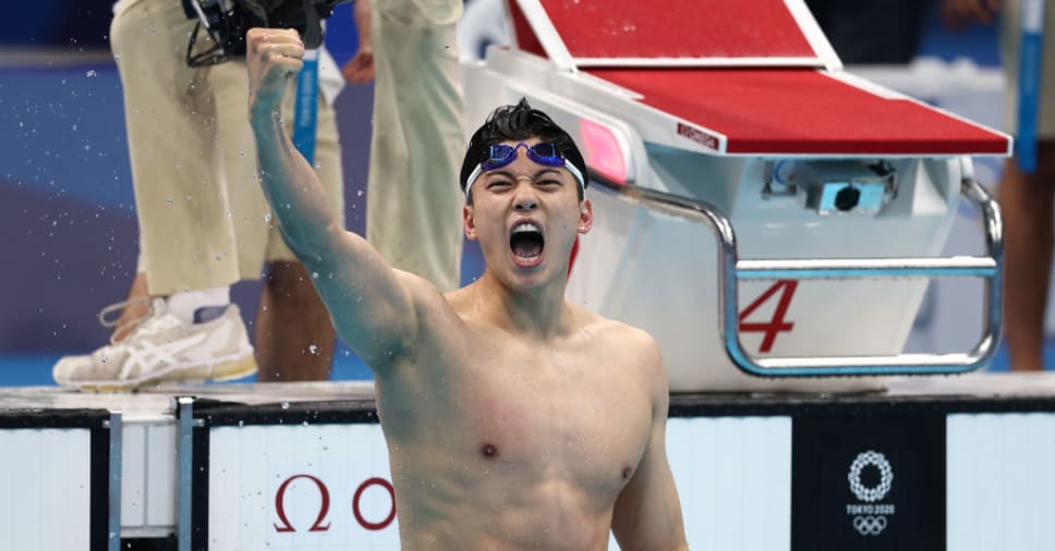 TOKYO, JAPAN - JULY 30: Shun Wang of Team China celebrates after winning a gold medal and breaking the asian record in the Men's 200m Individual Medley Final on day seven of the Tokyo 2020 Olympic Games at Tokyo Aquatics Centre on July 30, 2021 in Tokyo, Japan. (Photo by Clive Rose/Getty Images)