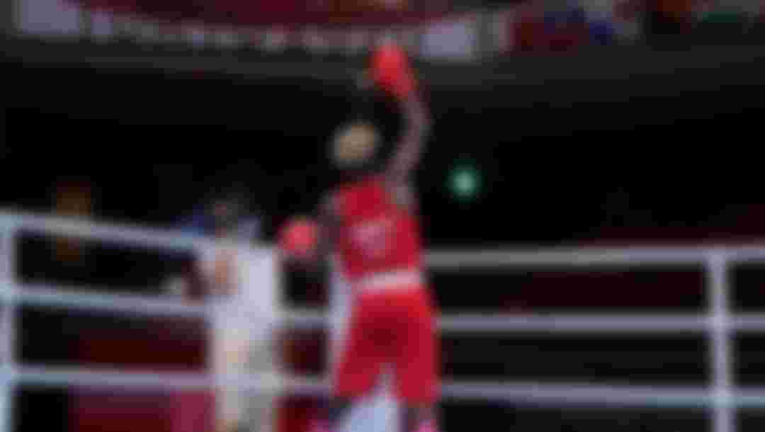 TOKYO, JAPAN - JULY 28: Samuel Takyi (red) of Ghana celebrates victory over Jean Carlos Caicedo Pachito of Ecuador during the Men's Feather (52-57kg) on day five of the Tokyo 2020 Olympic Games at Kokugikan Arena on July 28, 2021 in Tokyo, Japan. (Photo by Frank Franklin - Pool/Getty Images)