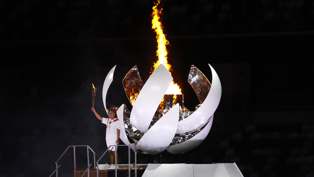 Naomi Osaka lights Olympic cauldron with symbol of hope to ...