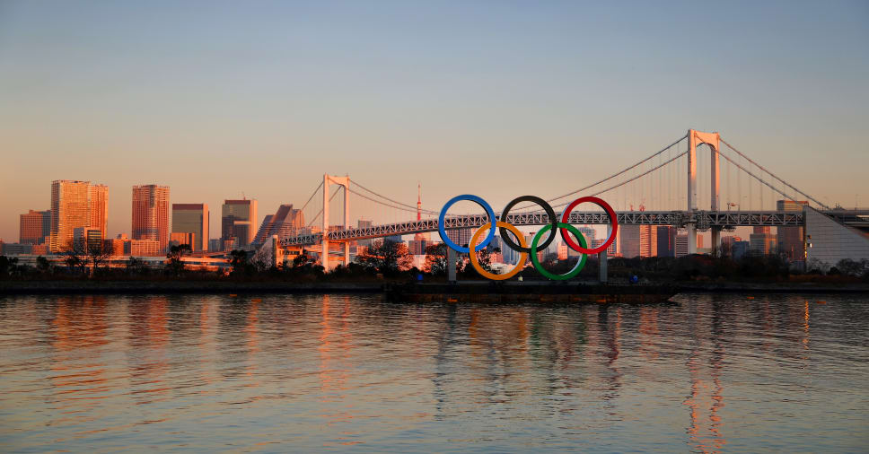 TOKYO, JAPAN - JANUARY 20: The Olympic rings are seen in front of Tokyo's iconic Rainbow Bridge and Tokyo Tower at Odaiba Marine Park on January 20, 2020 in Tokyo, Japan. (Photo by Clive Rose/Getty Images)